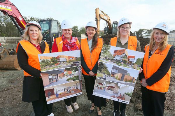 Group photo of Kangan Institute representatives and students at the site of the new campus