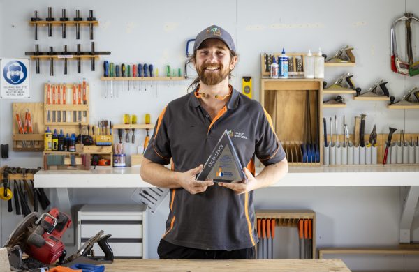 Myles in a carpentry workshop